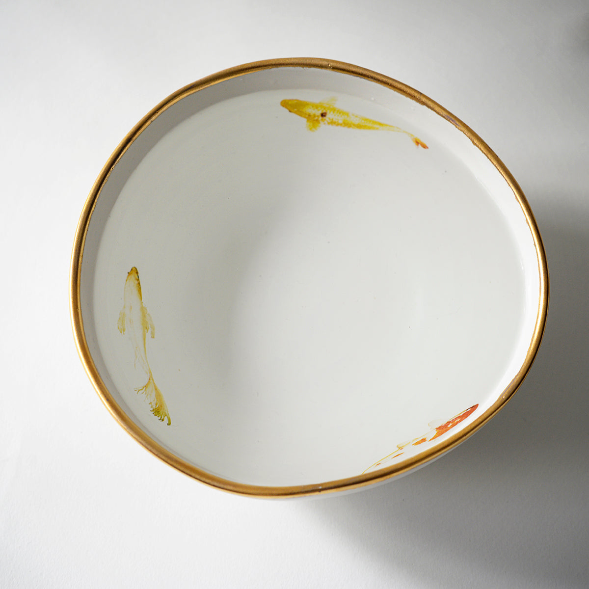 White bowl with Koi  and golden edge